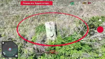 A BMP decoy near a tree line being hit by a Russian drone operator, on impact the decoy dismantled. June 2024