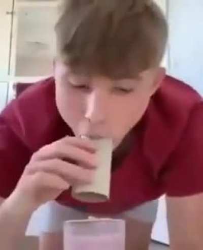 Idiot tries drinking milk with toilet paper roll