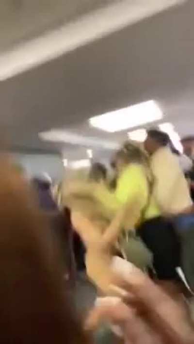 Huge fight at Miami International Airport due to passenger refusing to wear a mask
