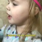 girl tries on eyeliner