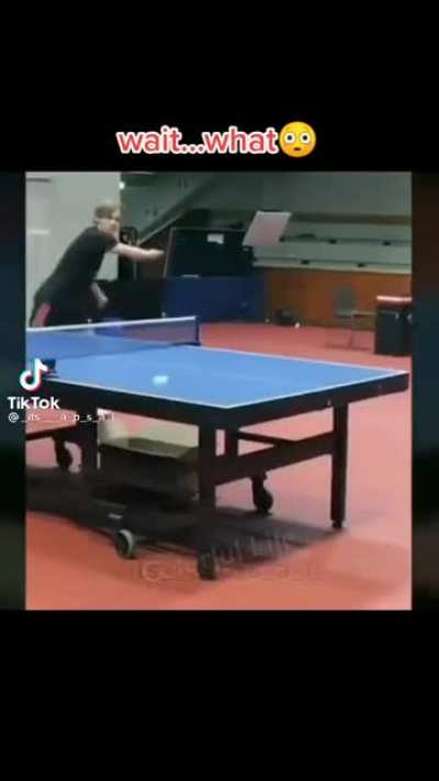 Guy in a sling throws his paddle at a ping pong and saves it!