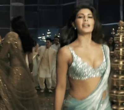 Babe seducing us in silver blouse