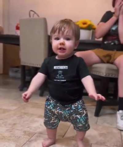 Baby taking first steps