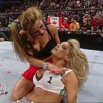 Mickie James kissing an unconscious Trish