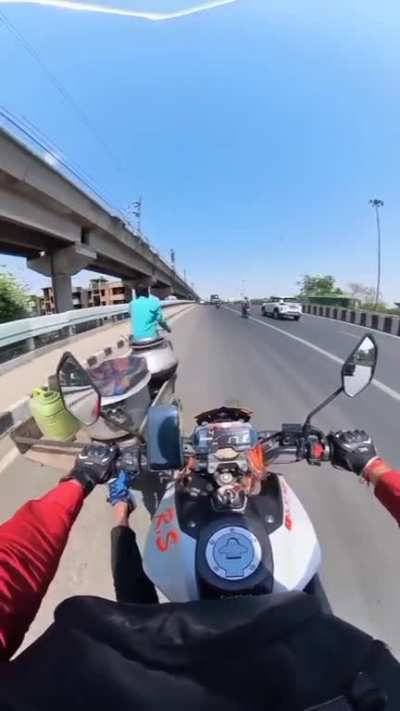 Bicker gives trike bike a push up hill on the freeway