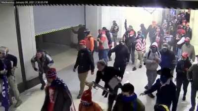 Video court exhibit released by US Justice Dept shows what happens as police tried to protect a closing door at US Capitol complex on Jan 6