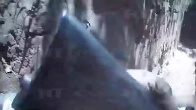 Russian army solider wipes out Ukrainians in a trench.
