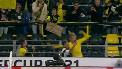 Kid holding a sign saying 