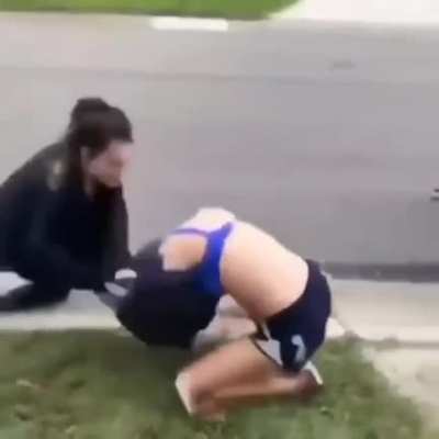 Two women street fighting