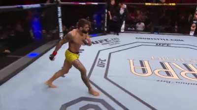 Sean Strickland taking a head kick instead of giving one.