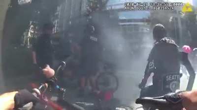 Man lures Seattle PD by blocking a camera with an umbrella. 