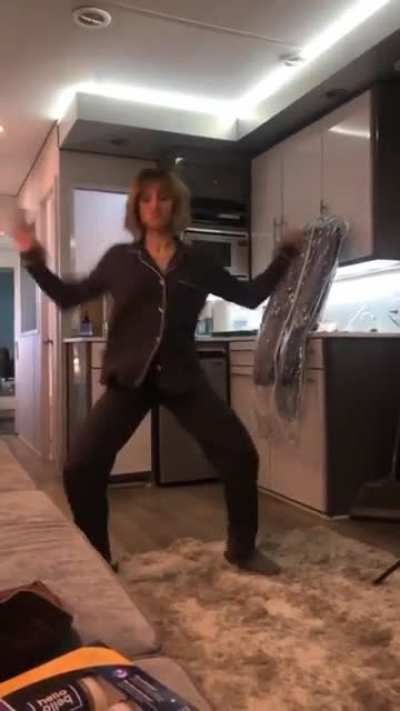 Kristen prepares for work, by working it.