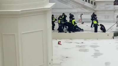 Cops beating the shit out of someone