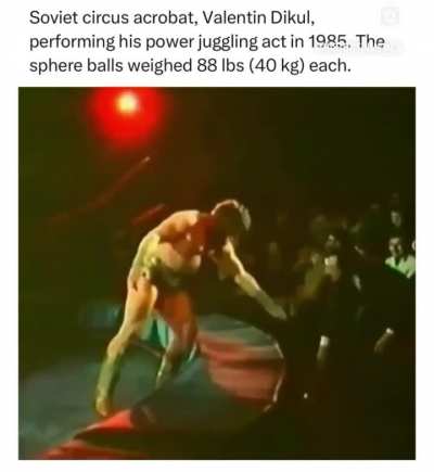 Soviet circus performer Valentin Dikul power juggling 40kg spheres in 1985.
