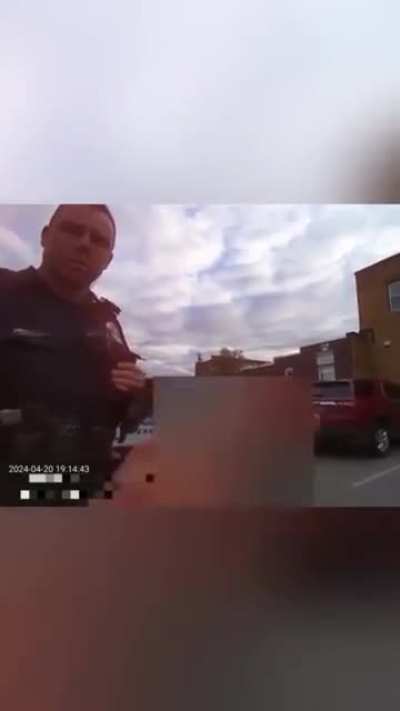 Entering the back of a police car like it's a taxi ride