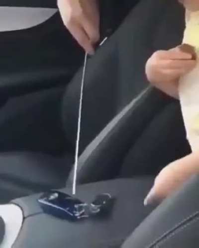 Little girl helping her father to open the door...