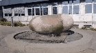 A Massive Boulder Getting Pushed Around On Top Of A Fountain