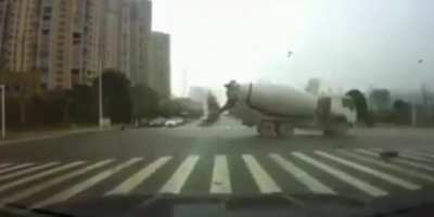 Cement truck slams into an ambulance, causing the patient to be ejected out the back of the ambulance