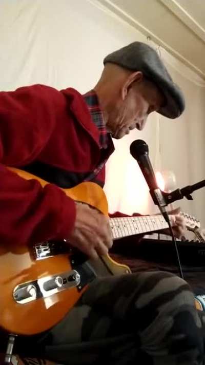 Old sage with his guitar