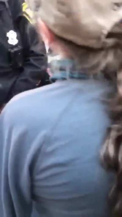CINCINNATI POLICE SHOWN WITH PROTESTOR UNCONSCIOUS AT THE JUSTICE CENTER AFTER BEING REFUSED WATER AND FOOD