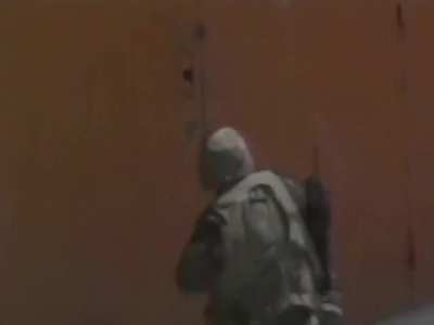 [Modern] American troops of the 10th Mountain Division blasts through the warehouse door in search of suspects who killed five civilians and injured 12 others via grenade attack in Port-au-Prince, Haiti (September 29, 1994)