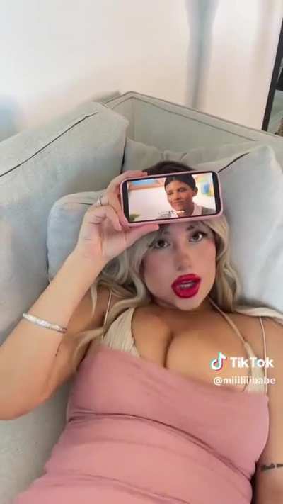 Her nip is literally slipping out 