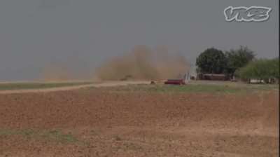 YPG fighters firing with a D-30 122mm howitzer at opposition, 2014