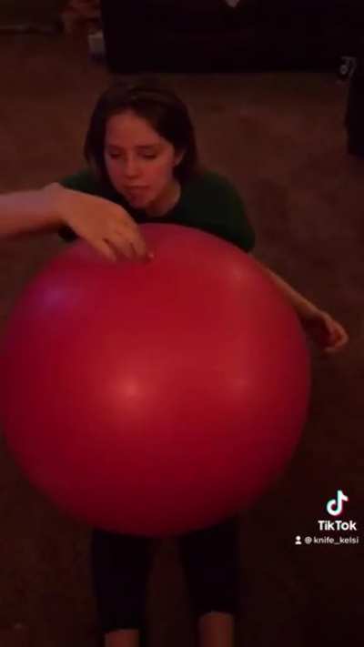 Girl gets kicked with an exercise ball
