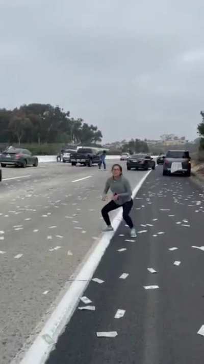 Money rained on roadway.