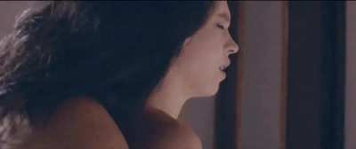 Otmara Marrero kissing Sydney Sweeney's neck in Clementine