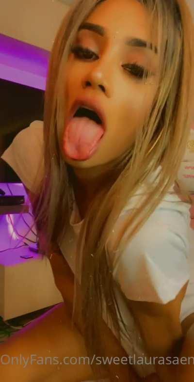 Laura tries her best to hide that huge thing