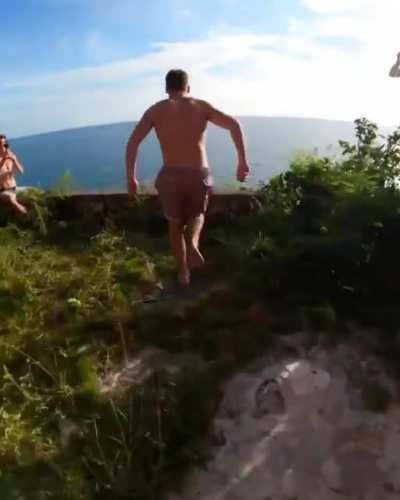 Jumping into the ocean in Bahamas