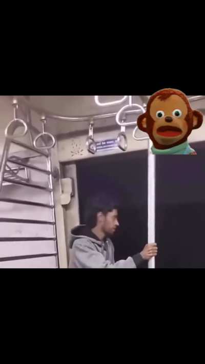 Man sticking his hand outside moving train