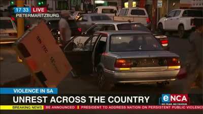 Guy trying to steal a TV