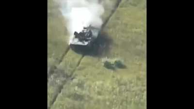 BMP carrying Russian soldiers on top gets hit