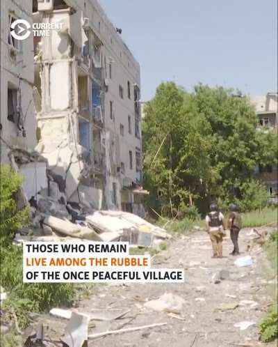 Ukrainian policemen urge locals to evacuate Lyptsi, a war-torn village 5 kilometers from the border with Russia. One local man has chosen to stay in the areato feed abandoned dogs