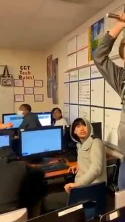 Insane kid hits another students head with a chair because he wanted to sit there.