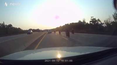 Biker cuts off and brake checks Pickup truck.