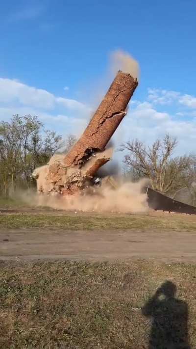 Two trucks doing their thing.