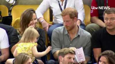 Kid gets caught stealing Prince Harry's popcorn