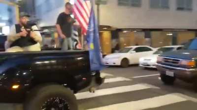 Video showing BLM protestors throwing things and burning Trump flags, then Pro Trump Supporters shooting paintballs and mace into the protestors in Portland