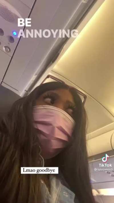 Flight Attendant On A Plane is annoyed at passengers for not wearing their masks