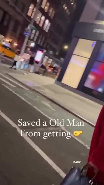 Passerby saves an old man from a stranger