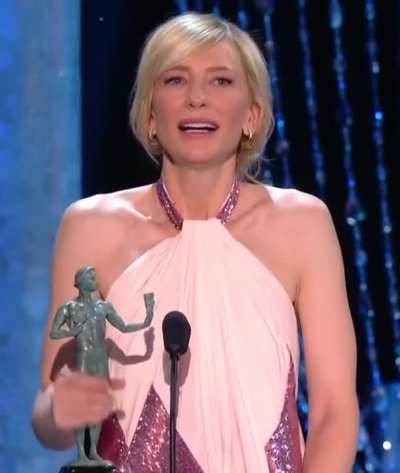 Cate Blanchett stroking her award