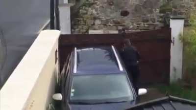 French police deal with a women wielding a shotgun