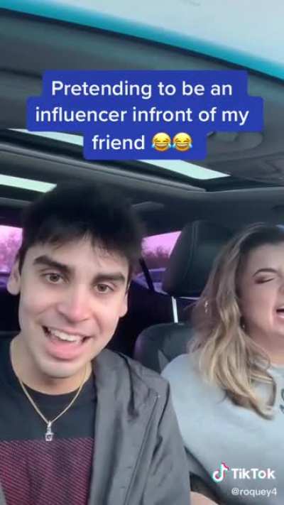 Pretending to be an influencer in front of his friend