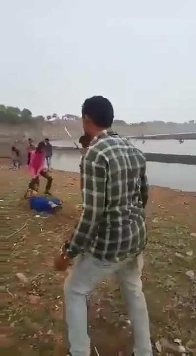 Woman in Dhar, Madhya Pradesh state in India beaten by family members for talking to a man on mobile phone
