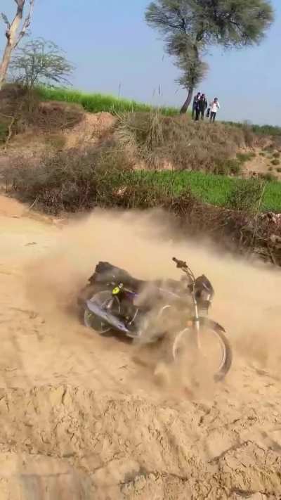 Racing a bike on sand for clout