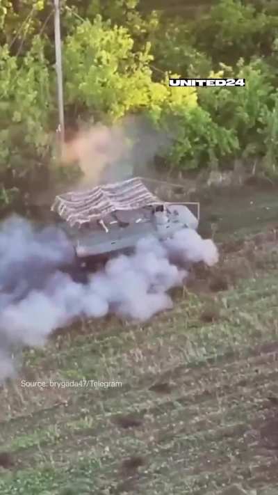 After dropping off some soldiers, a Russian MT-LB comes under fire from a 25mm Bushmaster cannon of a Ukrainian M2A2 Bradley. 