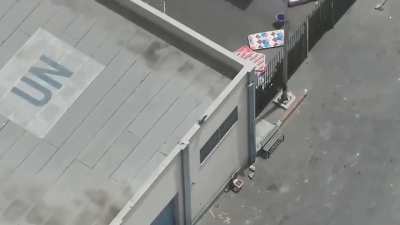 Armed militants operating and firing at civilians while at a UNRWA logistics center